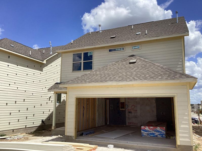 Front exterior of a new home in The Cottages at Lariat, Liberty Hill, TX, highlighting curb appeal (Image 2). Front exterior of a new home in The Cottages at Lariat, Liberty Hill, TX, highlighting curb appeal (Image 2).
