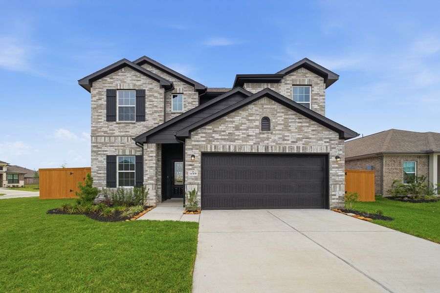 Front exterior of a new home in Lago Mar, Texas City, TX, highlighting curb appeal (Image 1). Front exterior of a new home in Lago Mar, Texas City, TX, highlighting curb appeal (Image 1).
