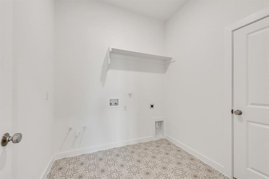 Washroom featuring gas dryer hookup, hookup for an electric dryer, and hookup for a washing machine Washroom featuring gas dryer hookup, hookup for an electric dryer, and hookup for a washing machine