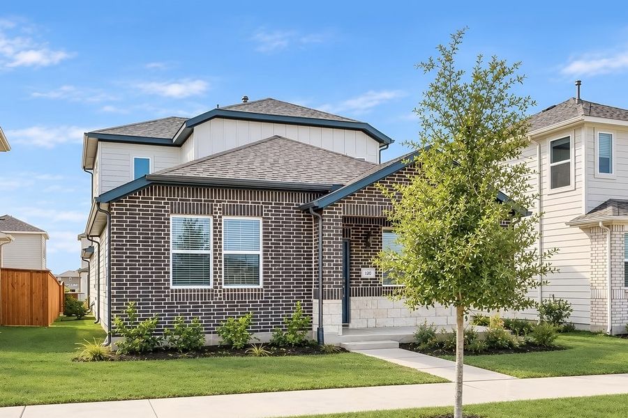 Front exterior of a new home in Emory Crossing, Hutto, TX, highlighting curb appeal (Image 16). Front exterior of a new home in Emory Crossing, Hutto, TX, highlighting curb appeal (Image 16).