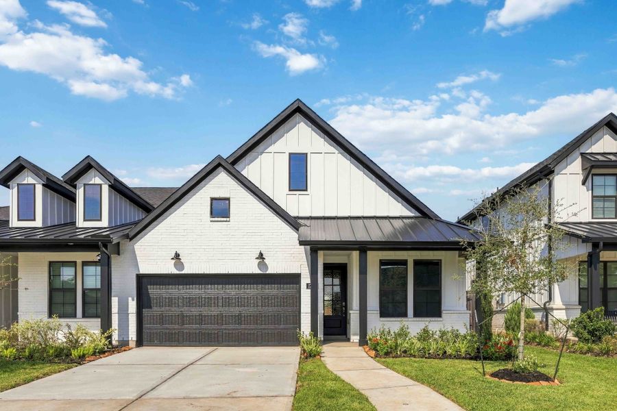 Front exterior of a new home in Sienna, Missouri City, TX, highlighting curb appeal (Image 1). Front exterior of a new home in Sienna, Missouri City, TX, highlighting curb appeal (Image 1).