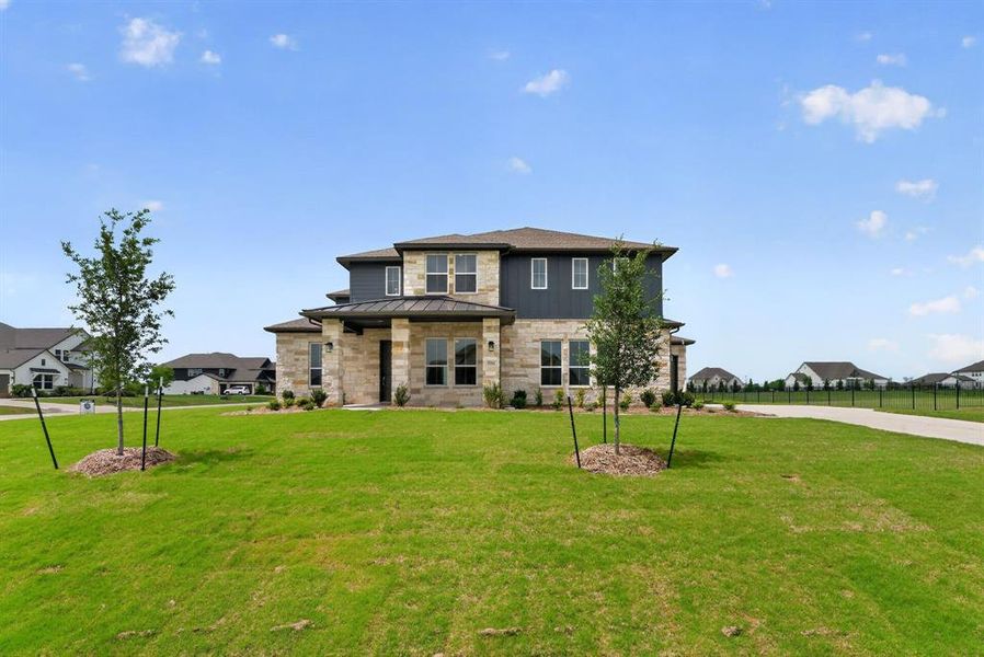 Front exterior of a new home in Highland Crossing, Celina, TX, highlighting curb appeal (Image 18).