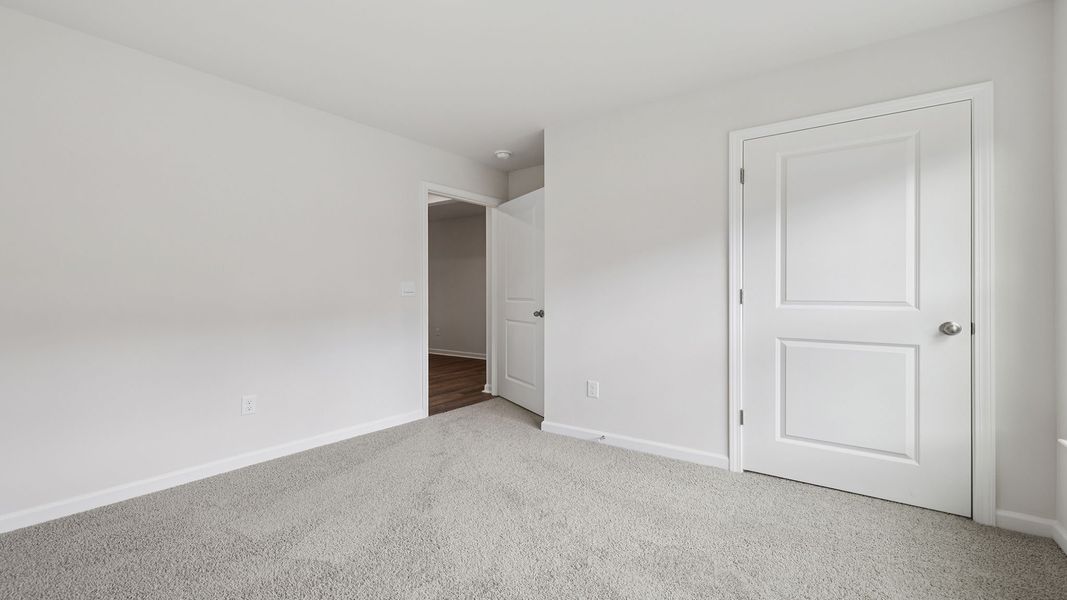 Spacious, unfurnished interior of a new home in Bentley Park, Greenwood (Image 14).