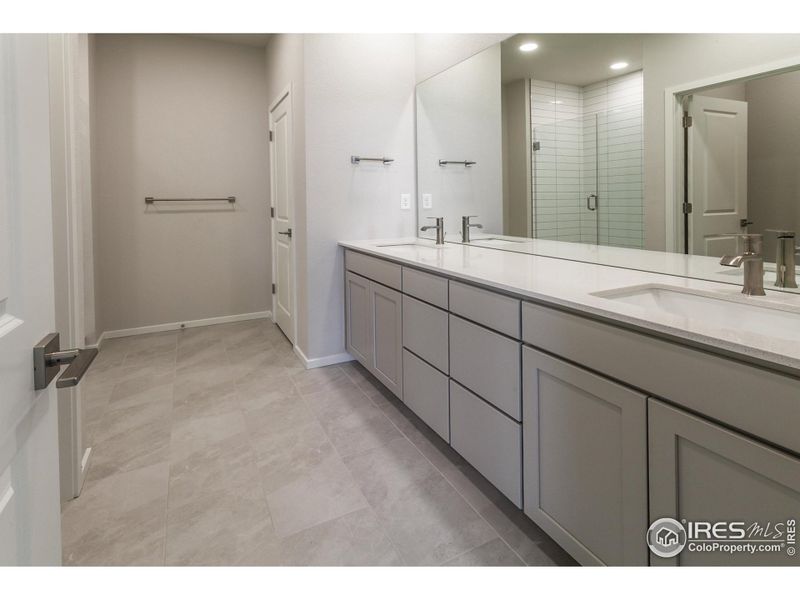 Primary Bathroom with dual vanities