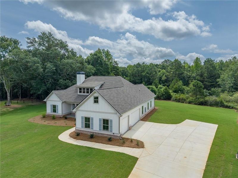 Front exterior of a new home in , Social Circle, GA, highlighting curb appeal (Image 21).