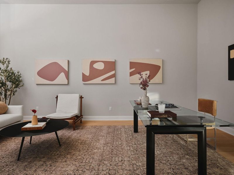 The Execuitve home office with large picture windows provides an ideal work-from-home setting.