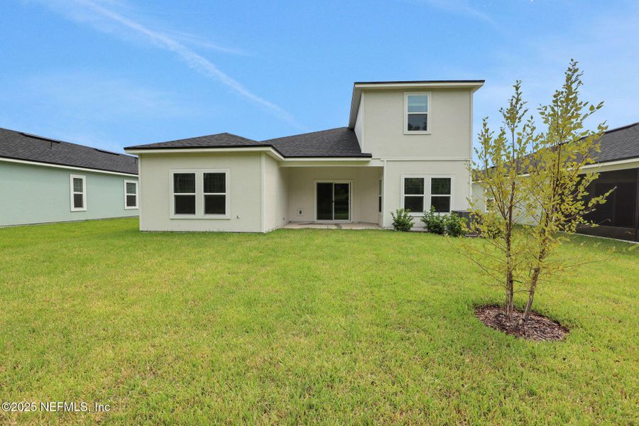 Front exterior of a new home in Cordova Palms, St. Augustine, FL, highlighting curb appeal (Image 20).