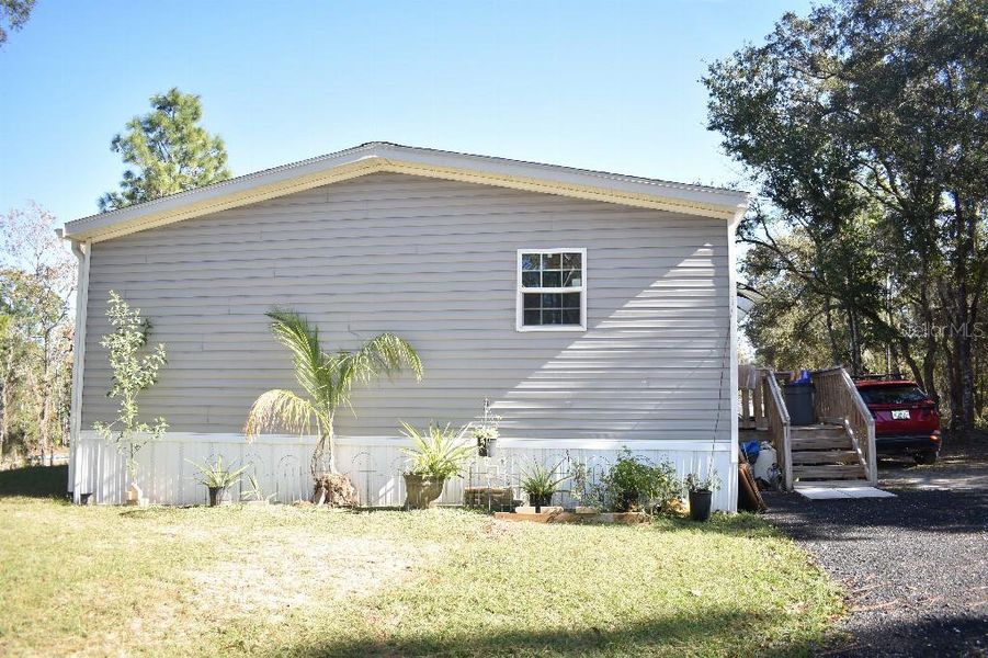 Exterior details and patio area of a home in , Williston (Image 31).