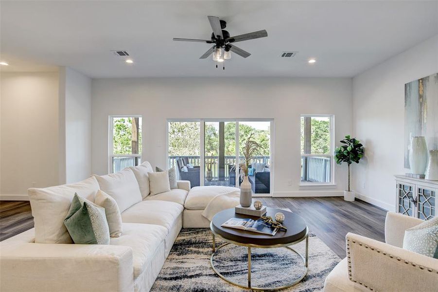 A gorgeous and airy living space with an expansive walk out balcony.