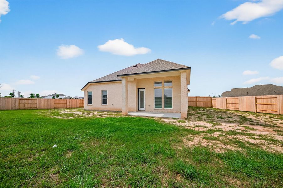 Front exterior of a new home in Lago Mar, La Marque, TX, highlighting curb appeal (Image 24).