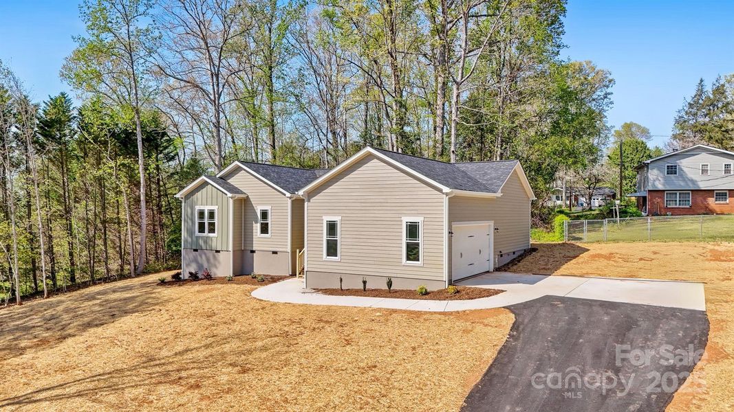 Front exterior of a new home in , Hickory, NC, highlighting curb appeal (Image 19).