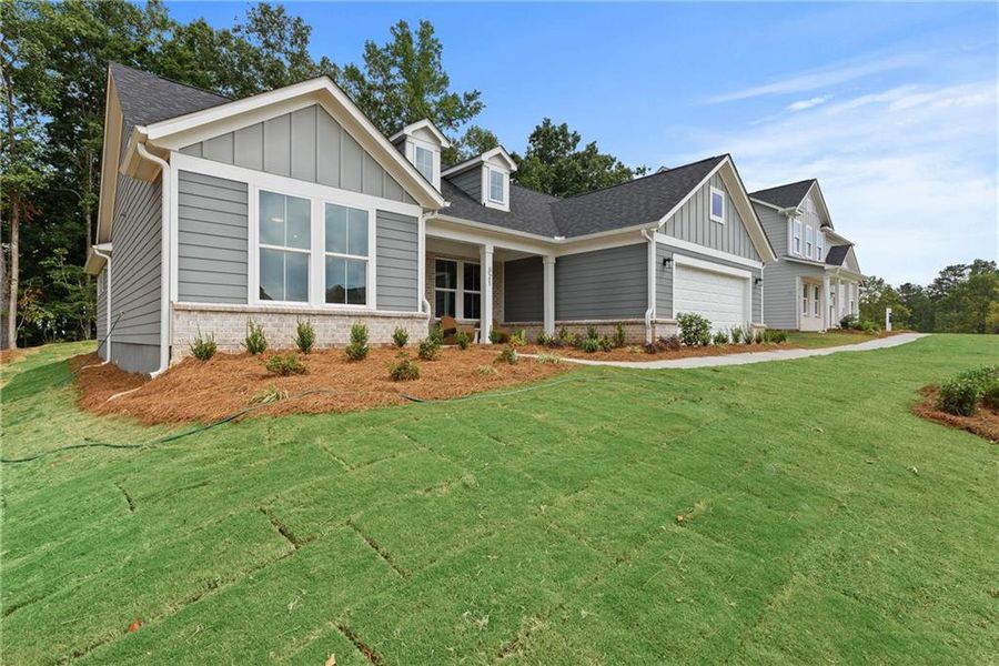 Exterior details and patio area of a home in Watermist at Mirror Lake, Villa Rica (Image 24).