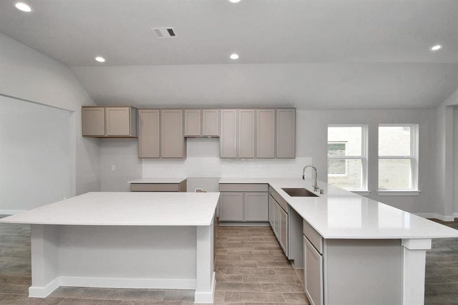 An extended counter area adds an extra layer of functionality. Sample photo of completed home. As-built color and selections may vary.