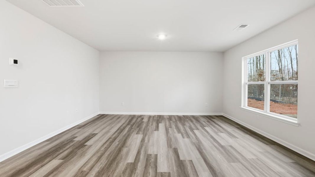 Spacious, unfurnished interior of a new home in Bentley Park, Greenwood (Image 20).