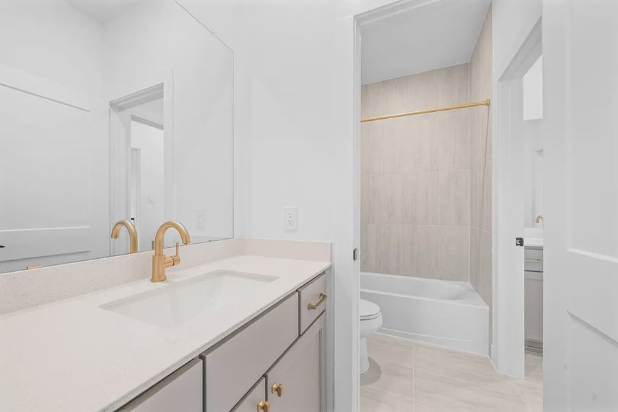 Representative furnished interior of a home built from the Madison by Chesmar Homes in Grange, Katy (Image 12).