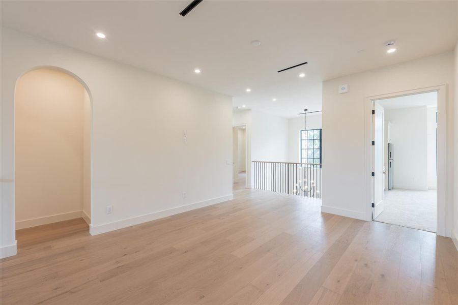 The second-floor flex space offers a bright and open layout perfect for a secondary living room, game room, or media lounge. Overlooking the foyer with a view of the statement chandelier, it creates a seamless connection between levels. The second-floor flex space offers a bright and open layout perfect for a secondary living room, game room, or media lounge. Overlooking the foyer with a view of the statement chandelier, it creates a seamless connection between levels.