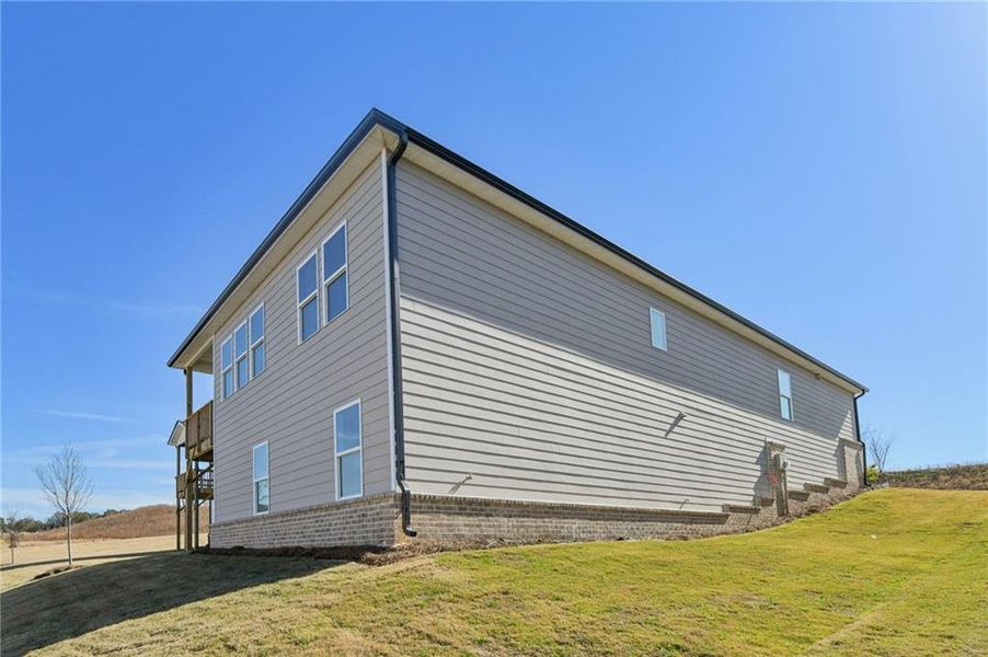 Exterior details and patio area of a home in Preserve at Mountain Creek, Pendergrass (Image 33).