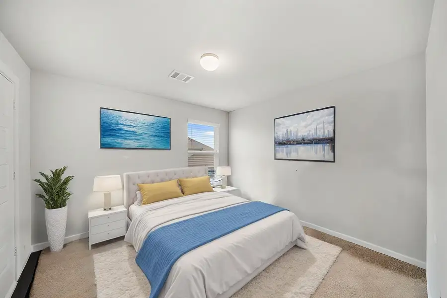 Virtually Staged: Secondary bedroom wtih carpet floors, a window with privacy blinds, and a built-in closet.