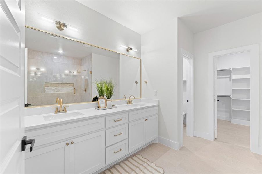 Bedroom featuring a tray ceiling, recessed lighting, light wood-type flooring, and baseboards Bedroom featuring a tray ceiling, recessed lighting, light wood-type flooring, and baseboards