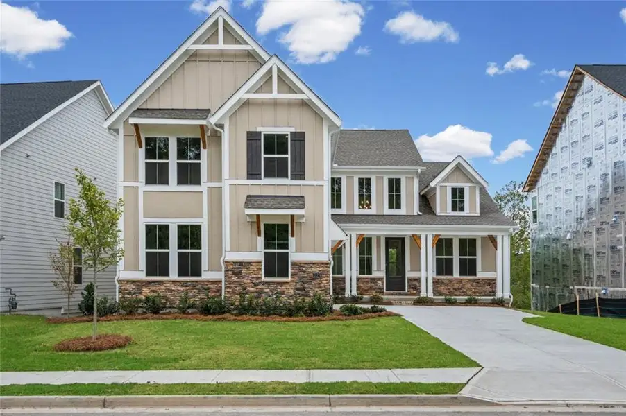 Front exterior of a new home in Twin Lakes, Hoschton, GA, highlighting curb appeal (Image 1). Front exterior of a new home in Twin Lakes, Hoschton, GA, highlighting curb appeal (Image 1).