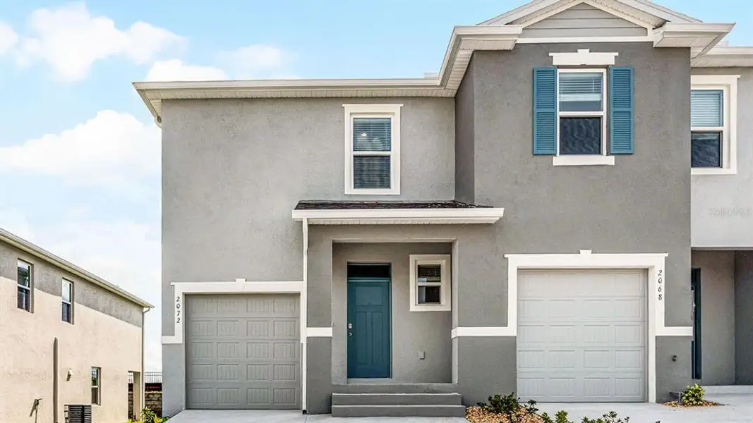 Front exterior of a new home in , Winter Haven, FL, highlighting curb appeal (Image 1). Front exterior of a new home in , Winter Haven, FL, highlighting curb appeal (Image 1).