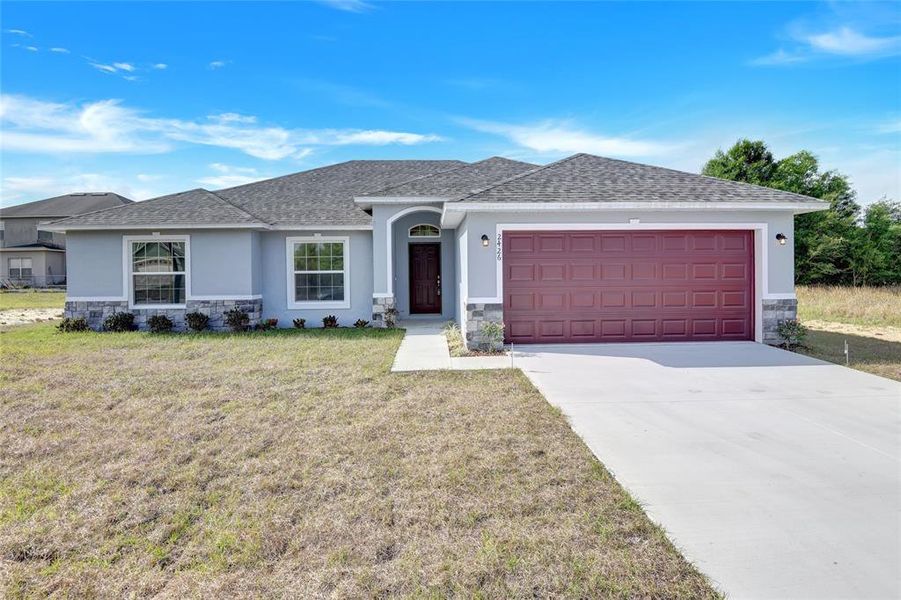 Front exterior of a new home in , Kissimmee, FL, highlighting curb appeal (Image 1). Front exterior of a new home in , Kissimmee, FL, highlighting curb appeal (Image 1).