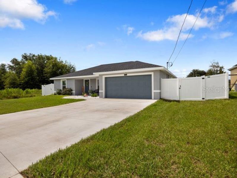 Front exterior of a new home in , Ocala, FL, highlighting curb appeal (Image 22).