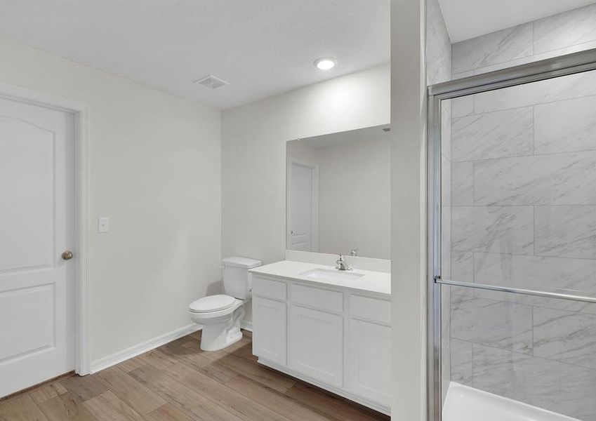 This bathroom has a glass-enclosed shower.