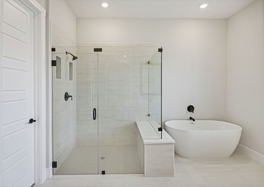The master bathroom has a large stand-alone tub and walk-in, glass shower. The master bathroom has a large stand-alone tub and walk-in, glass shower.