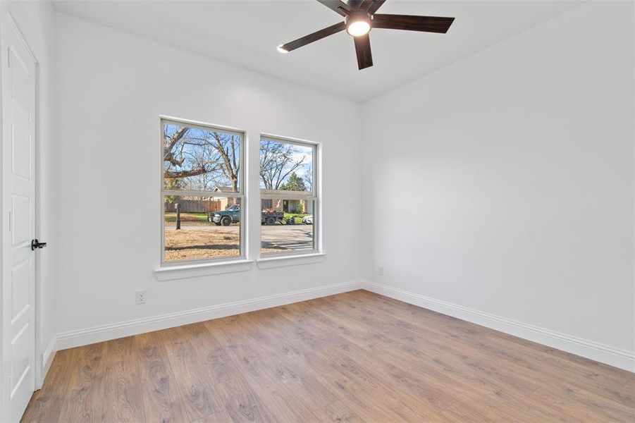 Spare room with ceiling fan and light hardwood / wood-style floors