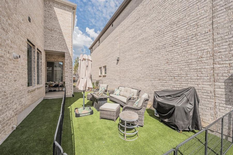 View of yard with an outdoor living space and a patio area