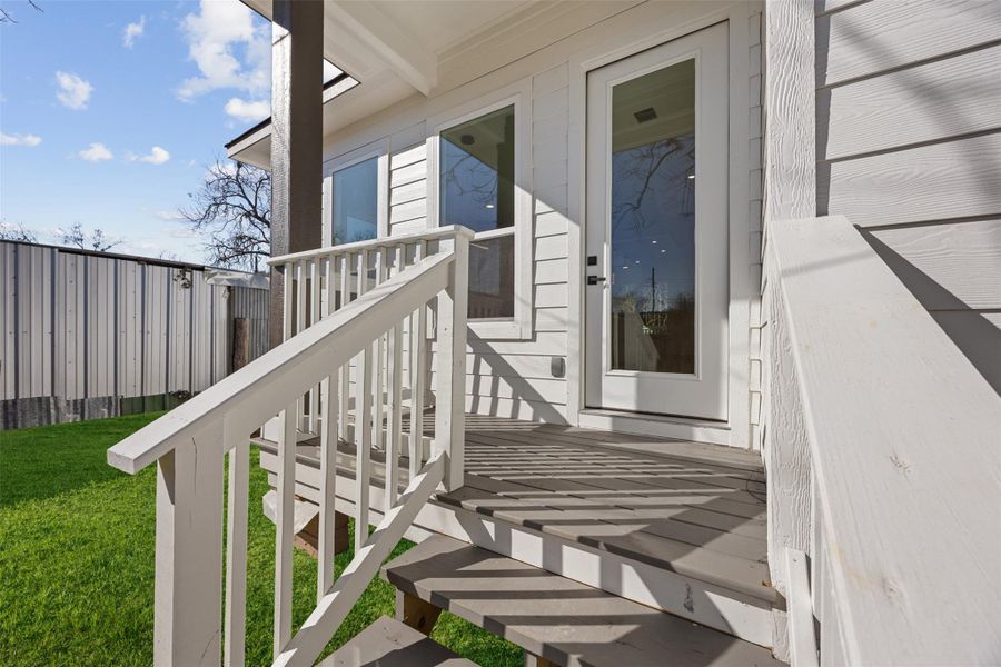 Steps to porch in the backyard.