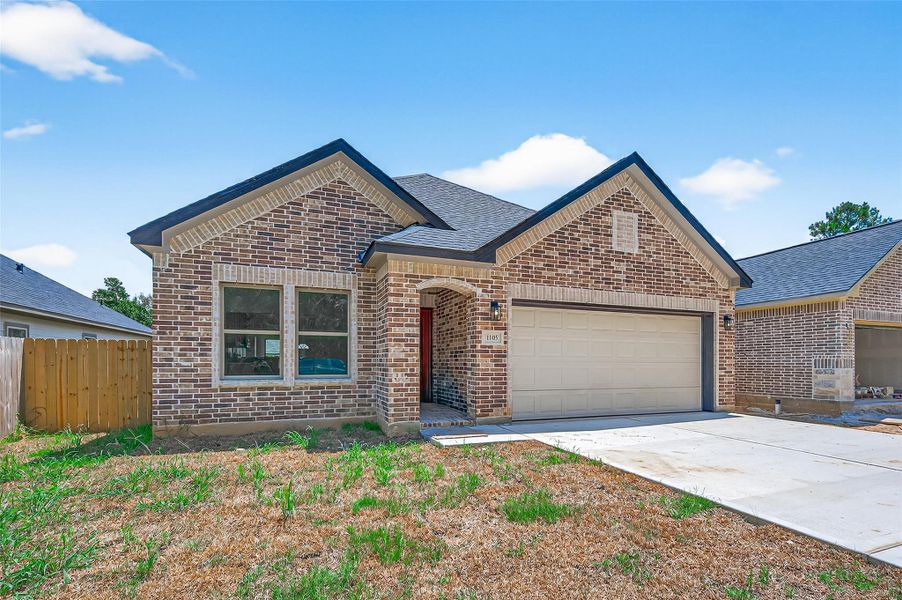 Front exterior of a new home in , Cleveland, TX, highlighting curb appeal (Image 26).