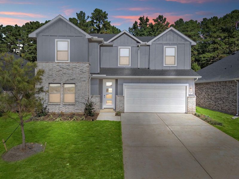 Front exterior of a new home in Westridge Cove, Conroe, TX, highlighting curb appeal (Image 1).