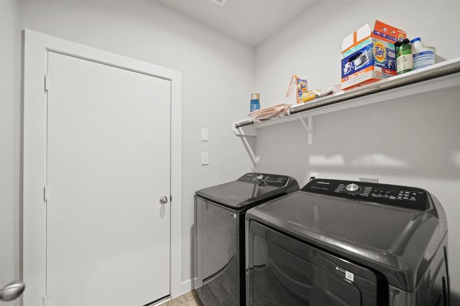 The thoughtfully designed mudroom features smart storage solutions, with custom lockers that effortlessly keep clutter under control.