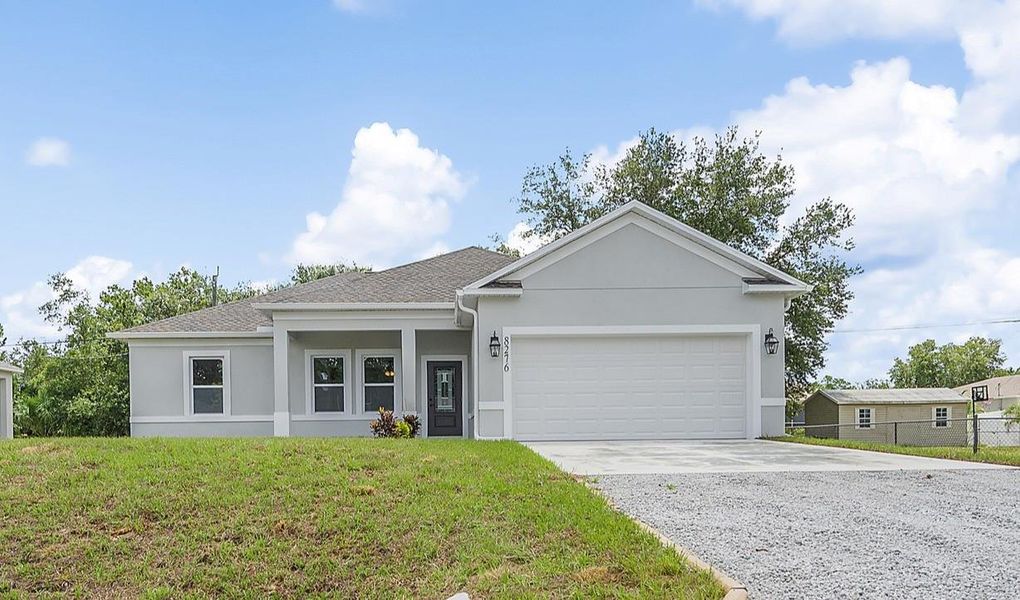 Front exterior of a new home in , Vero Beach, FL, highlighting curb appeal (Image 1).