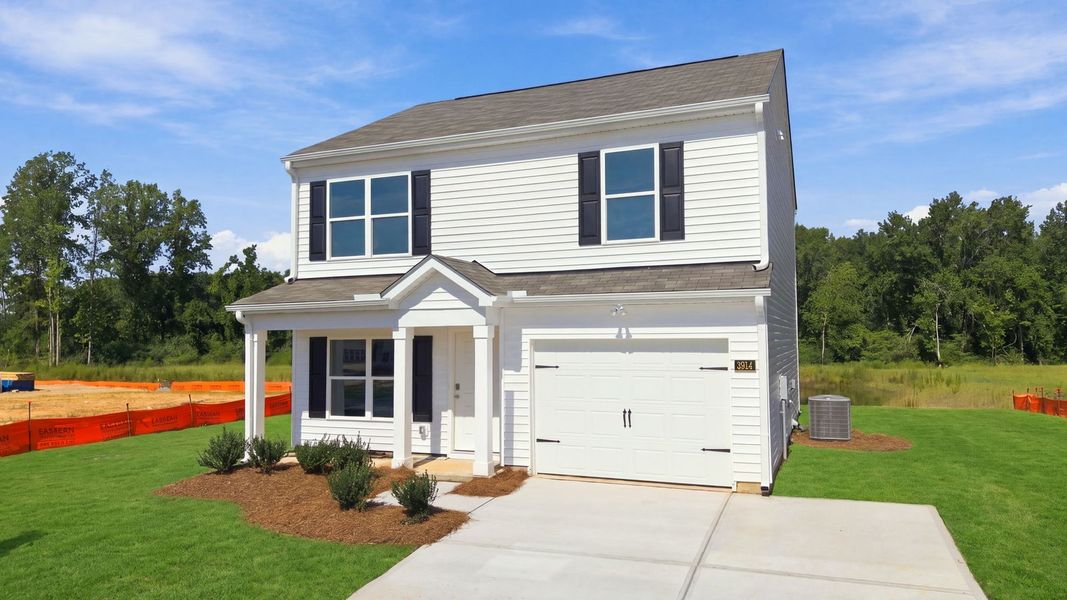 Front exterior of a new home in Hobbs Farm, Ayden, NC, highlighting curb appeal (Image 17).
