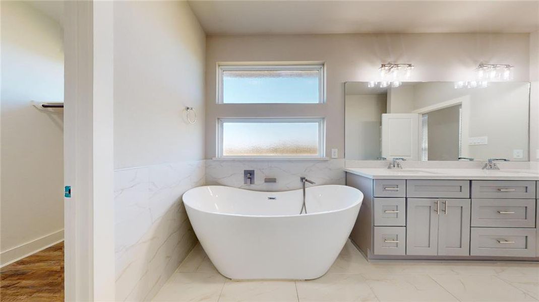 Relax in this grand soaking tub in the primary bath.