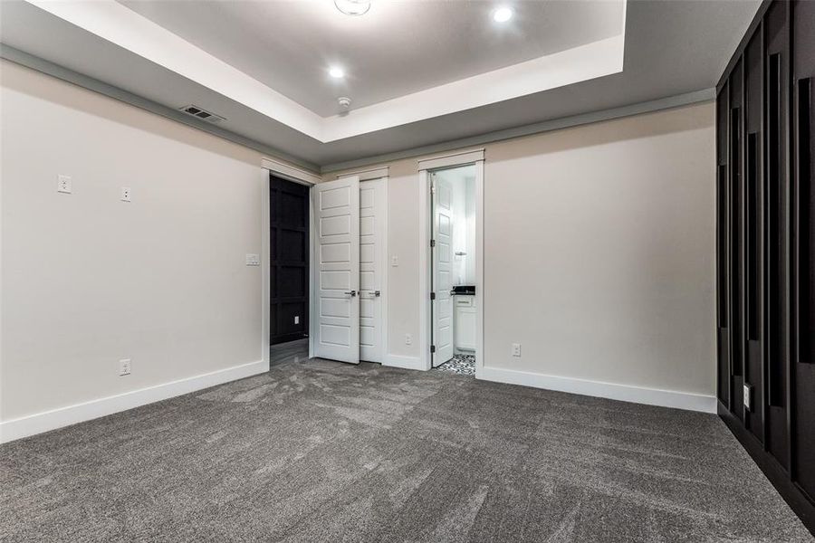 2nd Master Bedroom with gorgeous accent walls and 3 oversized windows with tray ceilings!!!