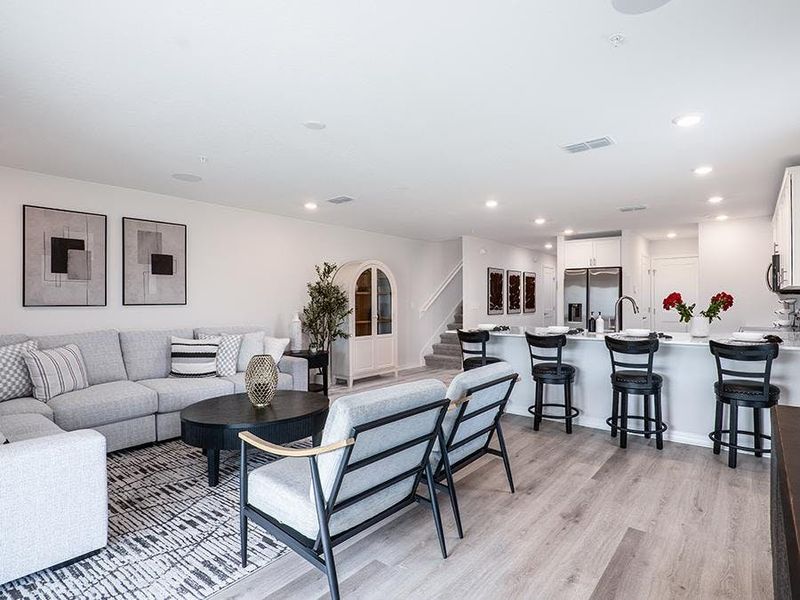 Enjoy a sunny and open living area - Daisy townhome by Highland Homes
