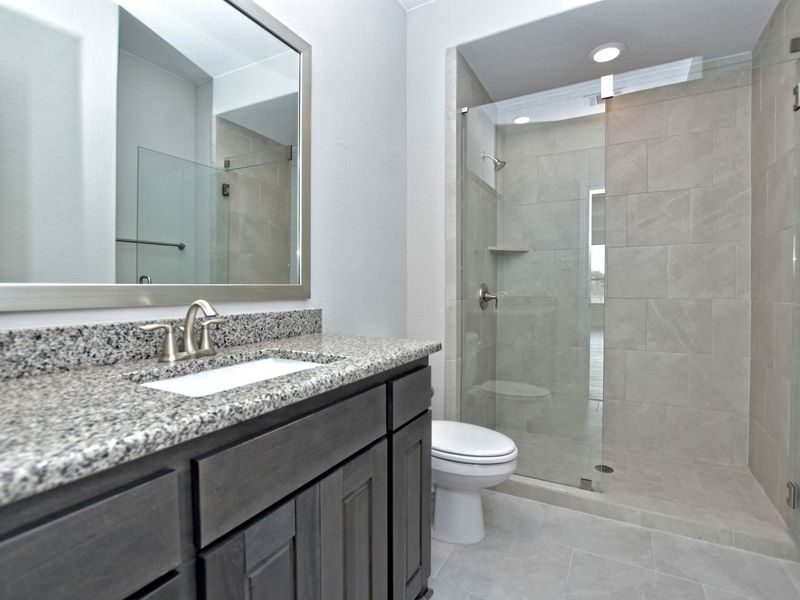 Representative furnished interior of a home built from the Madera II by Giddens Homes in Scofield Farms Estates, Georgetown (Image 183).