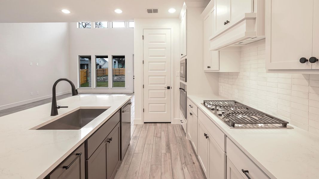 Furnished interior view inside a new home in 6 Creeks, Kyle (Image 9).