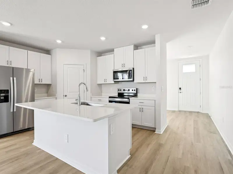 Furnished interior view inside a new home in Hilltop Vistas, Dade City (Image 5).