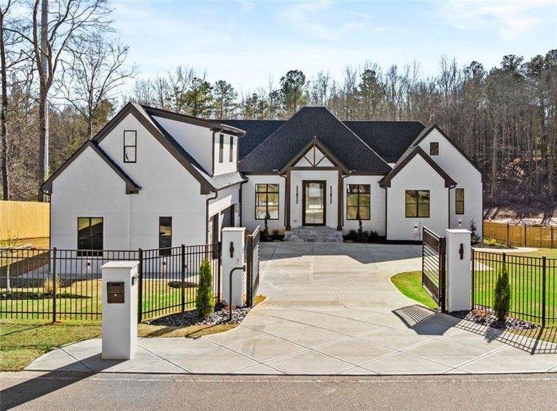 Front exterior of a new home in , Flowery Branch, GA, highlighting curb appeal (Image 1). Front exterior of a new home in , Flowery Branch, GA, highlighting curb appeal (Image 1).