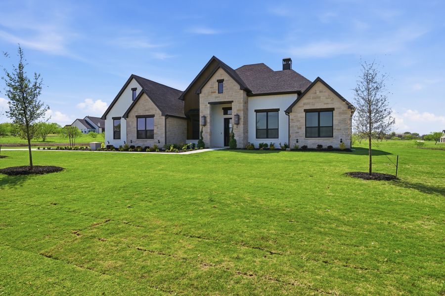 Front exterior of a new home in Summit Ranch, Aledo, TX, highlighting curb appeal (Image 28).