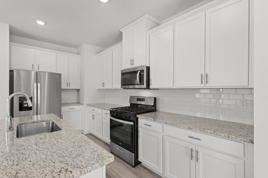 Furnished interior view inside a new home in Cypress Ridge - The Boardwalk Series, Longs (Image 7).