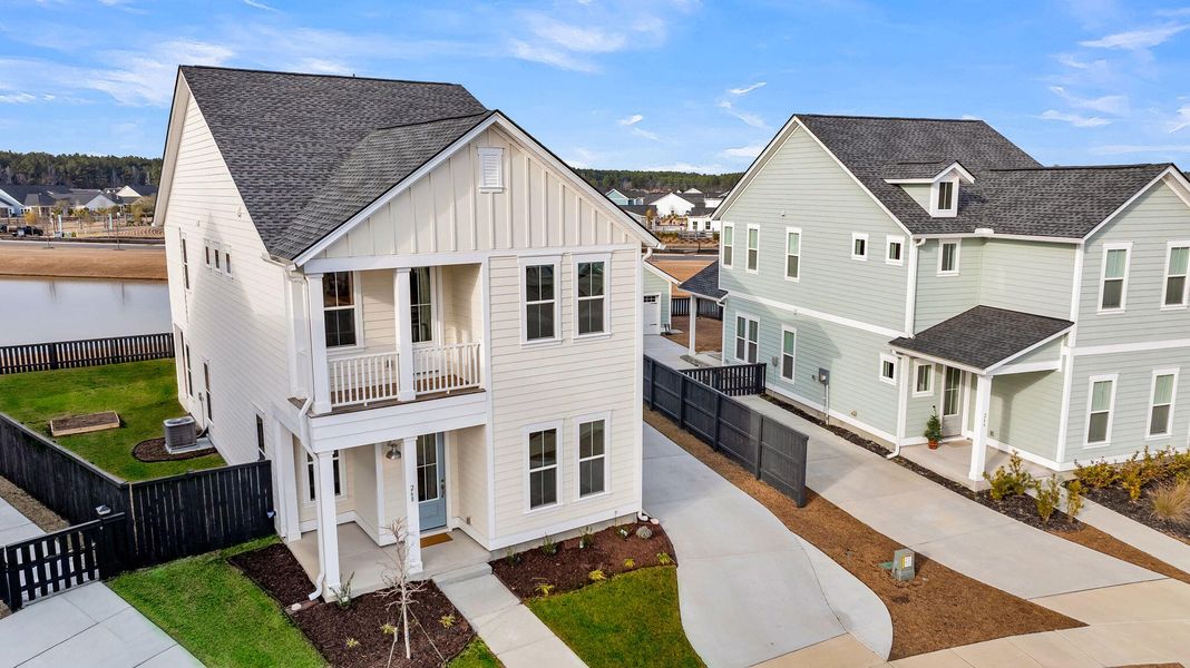 Front exterior of a new home in Carnes Crossroads, Summerville, SC, highlighting curb appeal (Image 21).