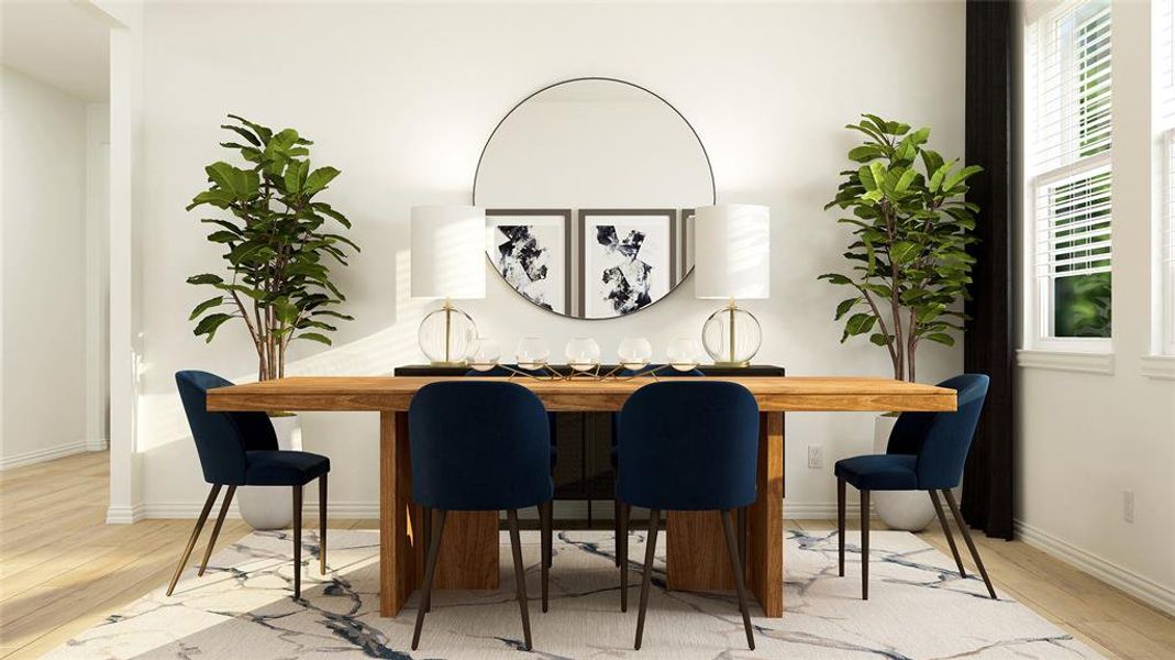 Dining space with light hardwood / wood-style flooring