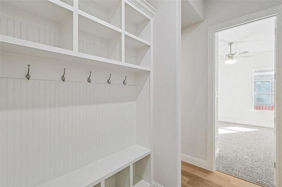 Mudroom featuring hardwood / wood-style floors and ceiling fan