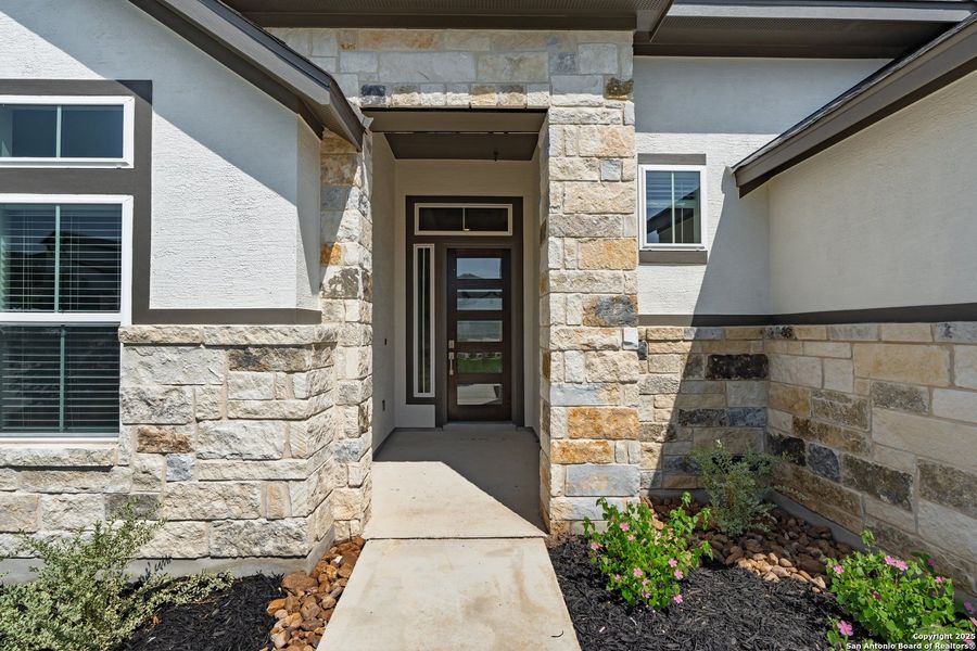 Front exterior of a new home in Esperanza – New Phase Now Selling, Boerne, TX, highlighting curb appeal (Image 26). Front exterior of a new home in Esperanza – New Phase Now Selling, Boerne, TX, highlighting curb appeal (Image 26).